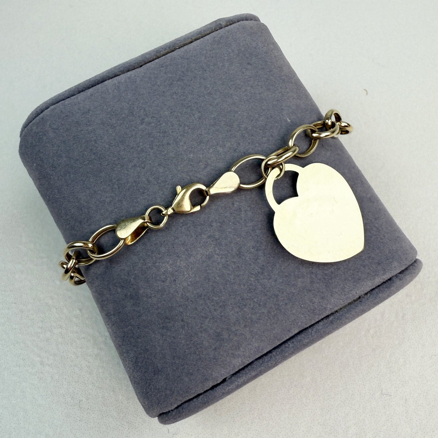 7" Oval Link Bracelet 10K Yellow Gold 6.69mm 4.76g with Heart Charm