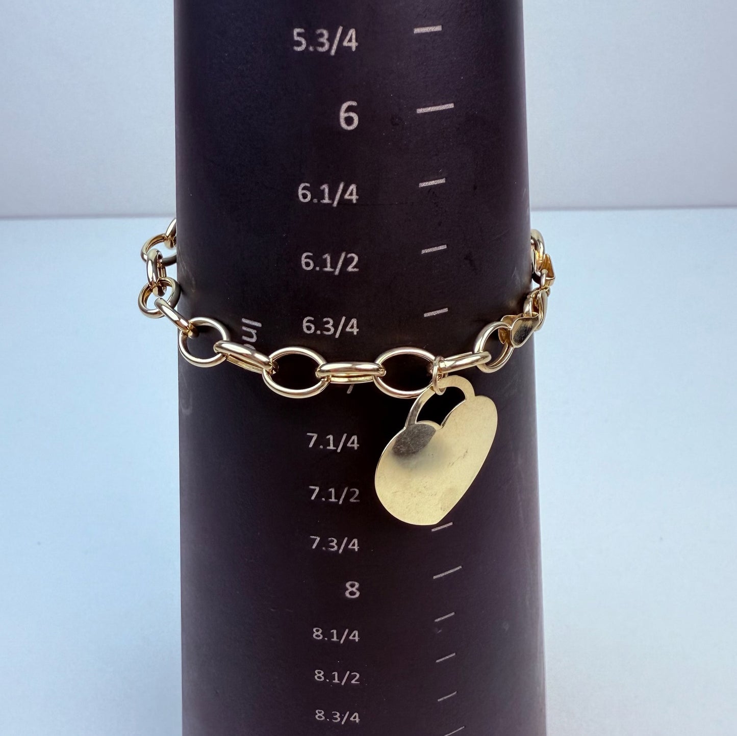 7" Oval Link Bracelet 10K Yellow Gold 6.69mm 4.76g with Heart Charm