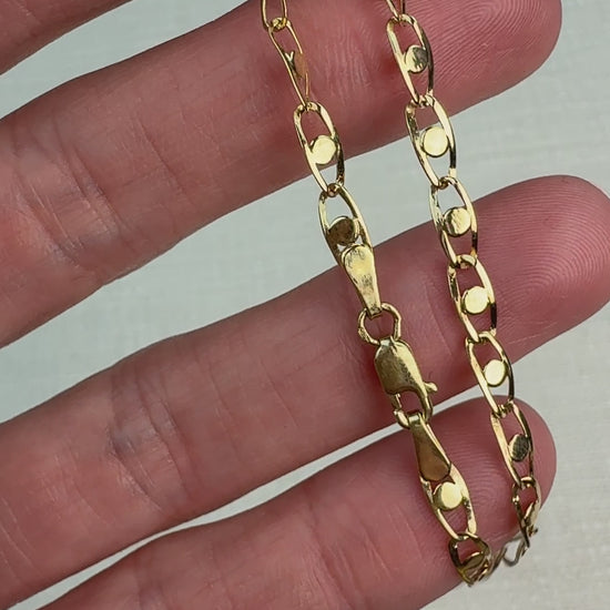 Short video of a fancy link chain bracelet gently moved in hand to show shine.