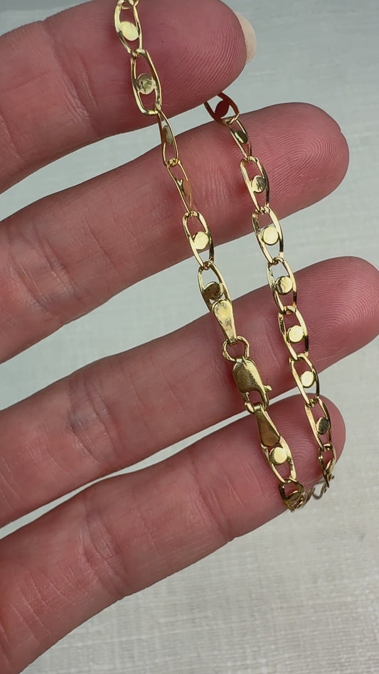 Short video of a fancy link chain bracelet gently moved in hand to show shine.